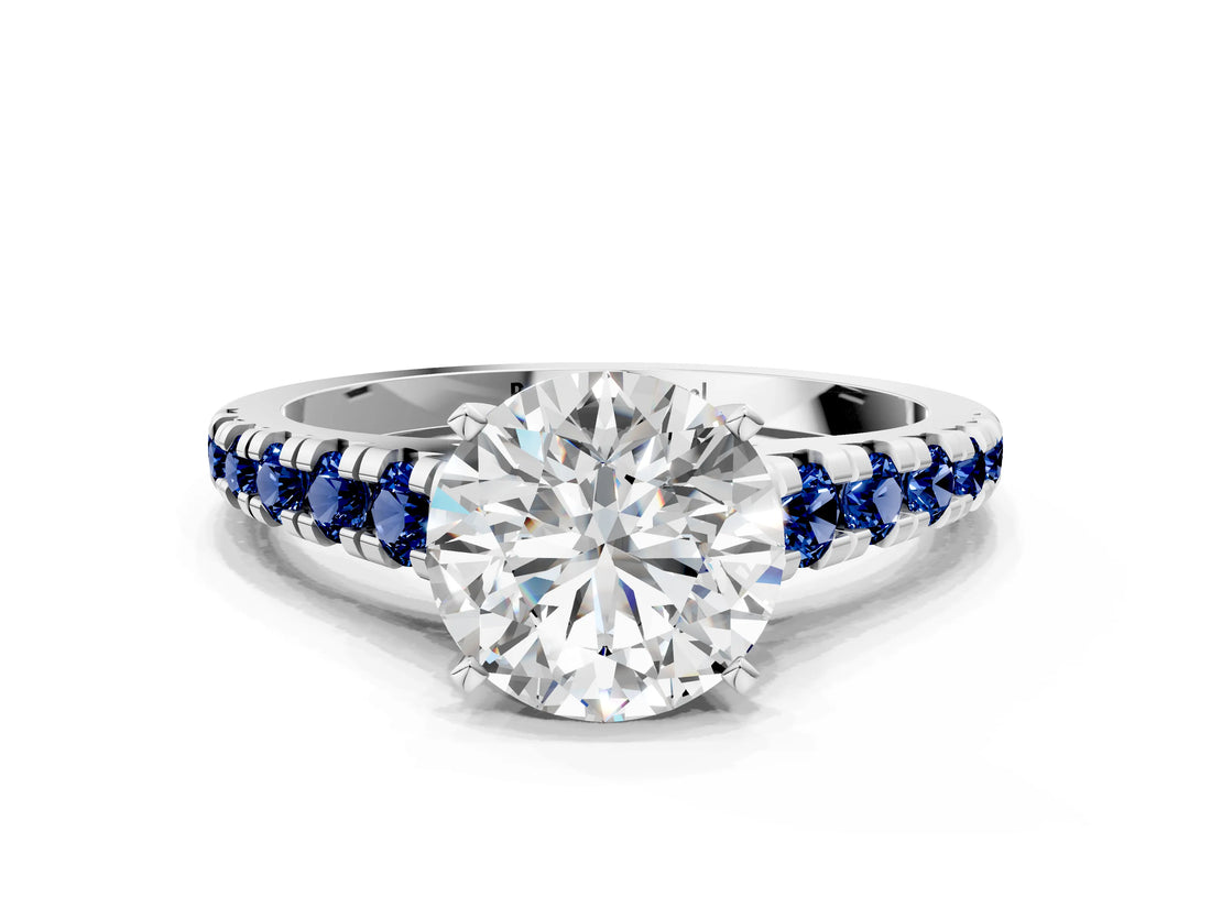 White gold Round Cut Diamond Cathedral Solitaire Ring with Round with Blue Sapphire side stone Pavé Band