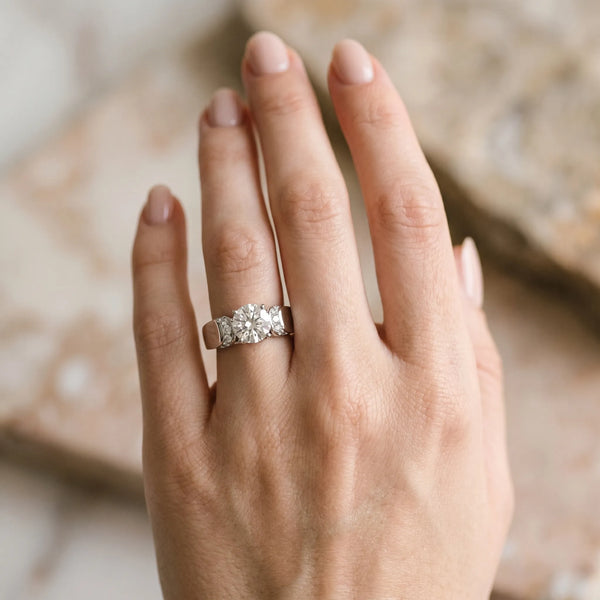 White gold Round Cut Diamond Channel Set Solitaire Ring with Four-Prong Setting