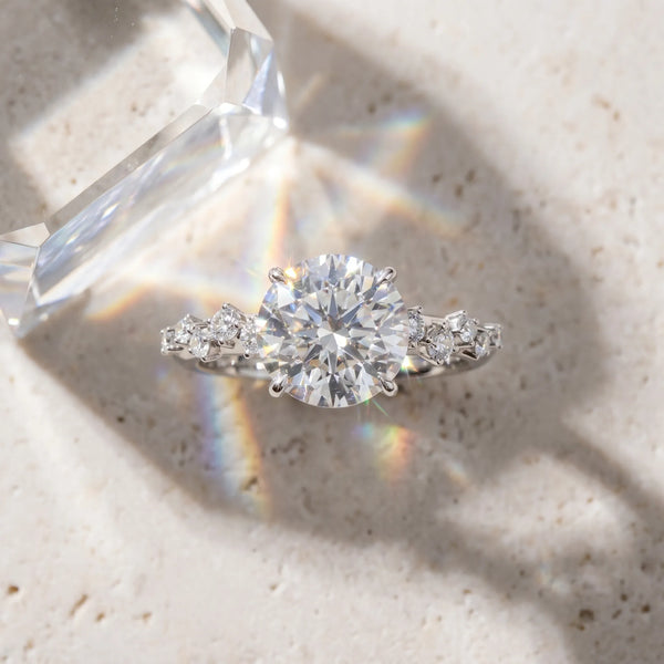 White gold Round Cut Diamond Cluster Side Stone Solitaire Ring with Prong Setting