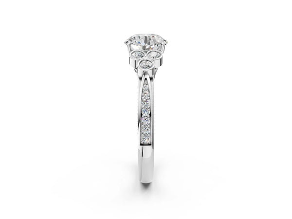 Platinum Round Cut Diamond Engagement Ring with Bezel Set Round Side Stones and Prong Setting