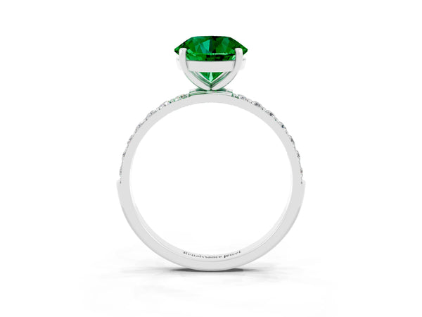 Silver Round Cut Emerald Solitaire Ring with Round Pavé Shoulders and Prong Setting