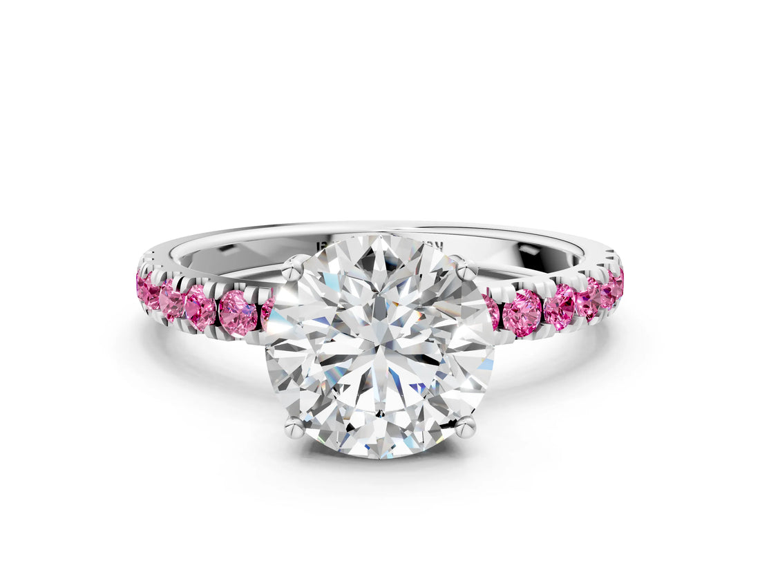 White gold Round Cut Diamond Pave Band Solitaire Ring with Round with Pink Sapphire side stone and Prong Setting