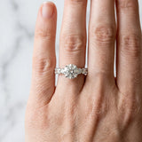 White gold Round Cut Diamond Prong Setting with Side Stones on a Pave Band_160