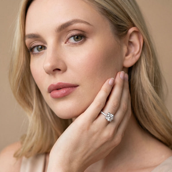 White gold Round Cut Diamond Ring with Pavé Band and Floral Prong Setting