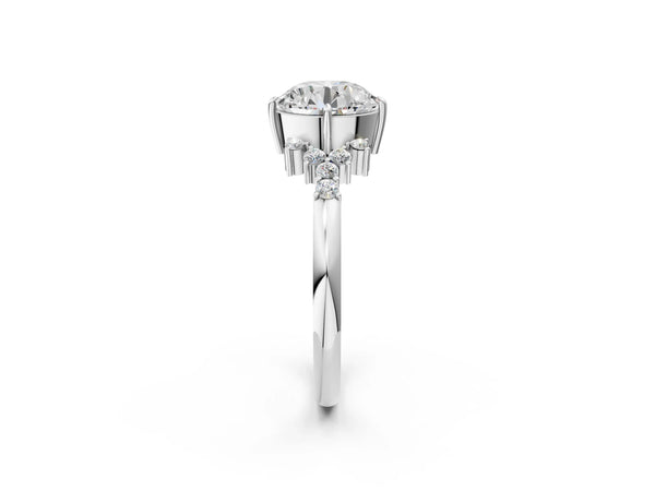Platinum Round Cut Diamond Ring with Side Stones and Four-Prong Setting