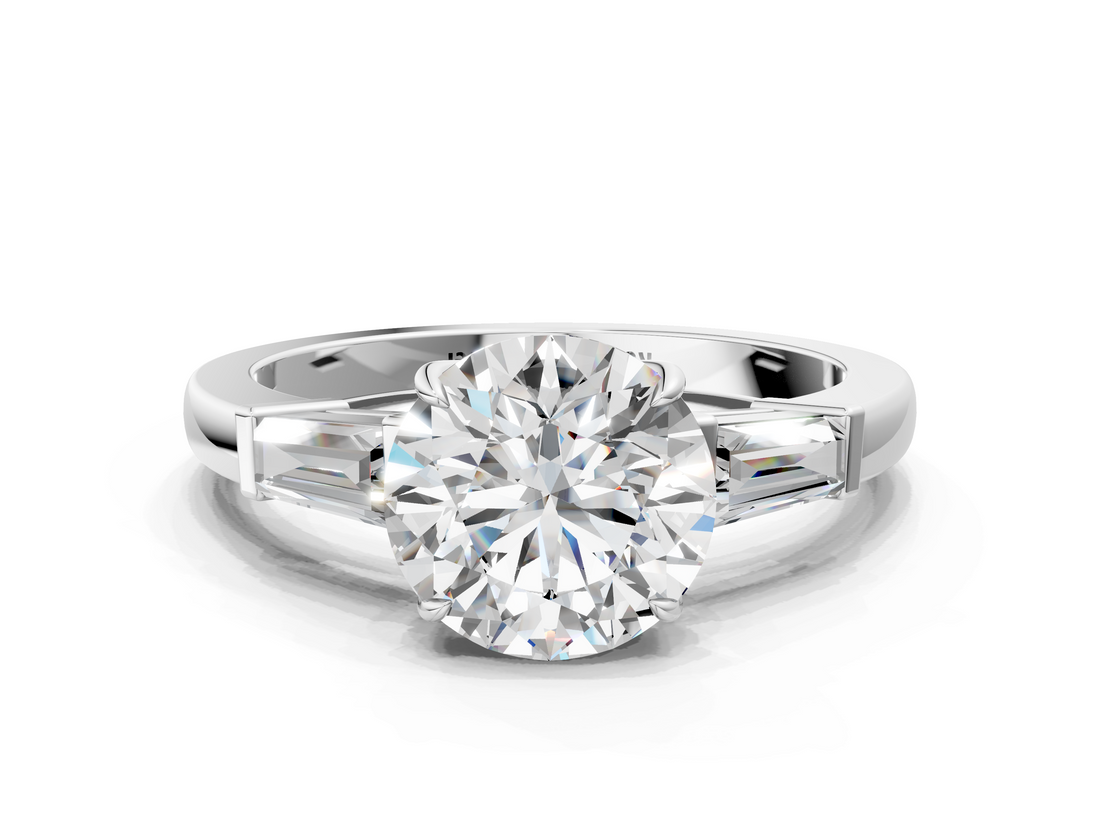 White gold Round Cut Diamond Ring with Tapered Baguette Side Stones in Four-Prong Setting_32
