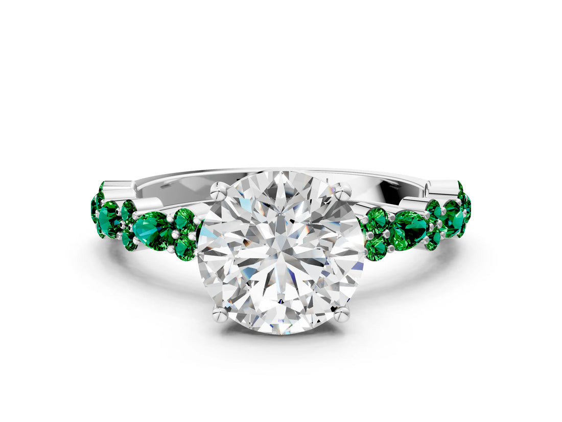 White gold Round Cut Diamond Side Stone Solitaire Ring with Round with Emerald side stone and Four-Prong Setting