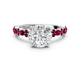White gold Round Cut Diamond Side Stone Solitaire Ring with Round with Garnet side stone and Four-Prong Setting