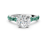 White gold Round Cut Diamond Side Stone Solitaire Ring with Round with Green Sapphire side stone and Four-Prong Setting