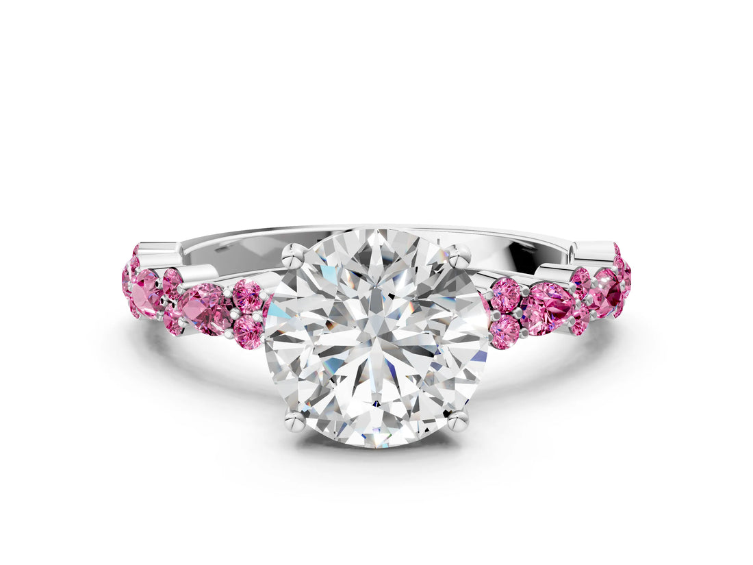 White gold Round Cut Diamond Side Stone Solitaire Ring with Round with Pink Sapphire side stone and Four-Prong Setting