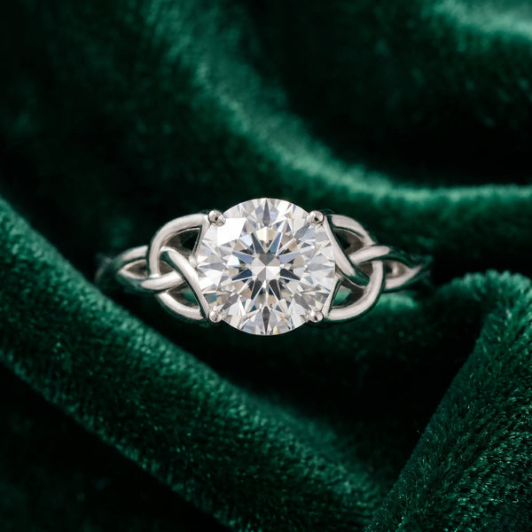 White gold Round Cut Diamond Solitaire Engagement Ring with Celtic Knot Band and Four-Prong Setting