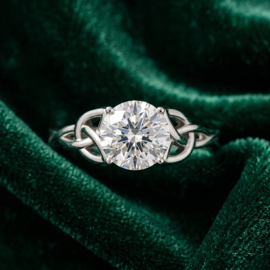 White gold Round Cut Diamond Solitaire Engagement Ring with Celtic Knot Band and Four-Prong Setting
