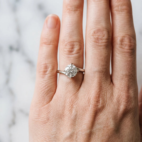 White gold Round Cut Diamond Solitaire Engagement Ring with Four-Prong Setting and Classic Band