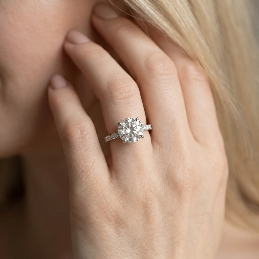 White gold Round Cut Diamond Solitaire Engagement Ring with Round  Pavé Band and Prong Setting