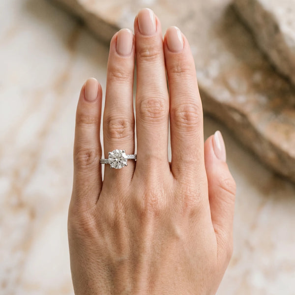 White gold Round Cut Diamond Solitaire Engagement Ring with Pave Band and Four-Prong Setting