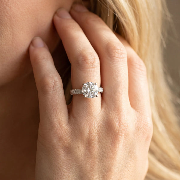 White gold Round Cut Diamond Solitaire Engagement Ring with Pave Band and Four-Prong Setting
