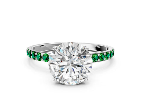 White gold Round Cut Diamond Solitaire Engagement Ring with Round with Emerald side stone Pavé Band and Prong Setting