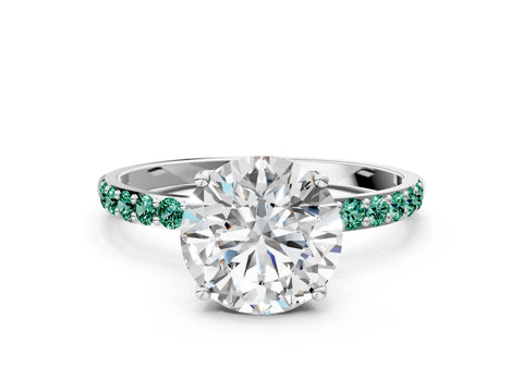 White gold Round Cut Diamond Solitaire Engagement Ring with Round with Green Sapphire side stone Pavé Band and Prong Setting