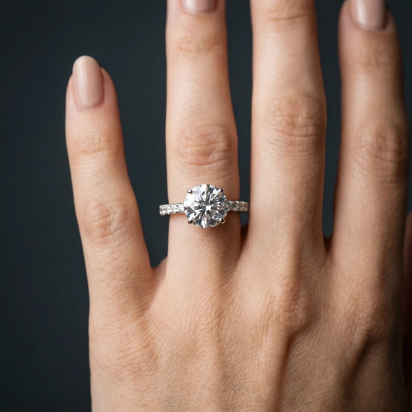 White gold Round Cut Diamond Solitaire Pavé Band with Four-Prong Setting