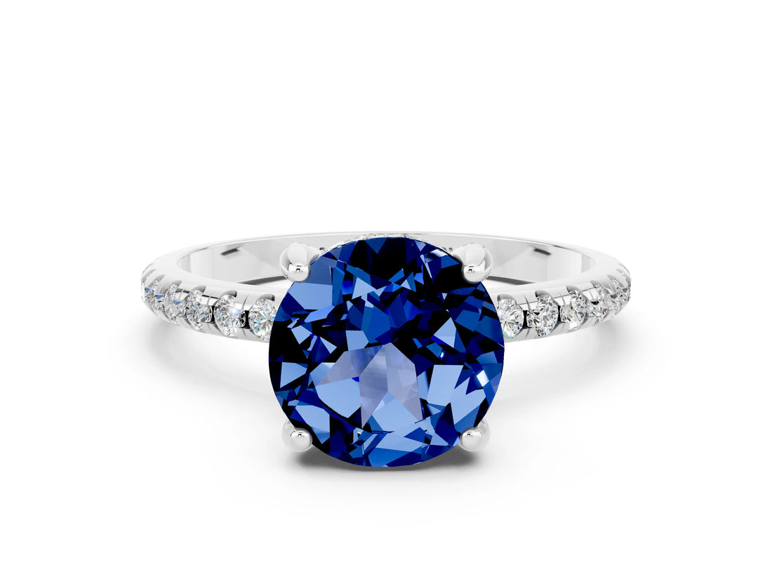 White gold Round Cut Diamond Solitaire Ring with Four-Prong Setting and Pavé Band