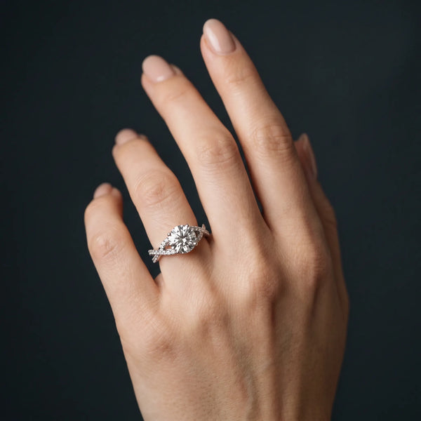White gold Round Cut Diamond Solitaire Ring with Four-Prong Setting and Twisted Pavé Band