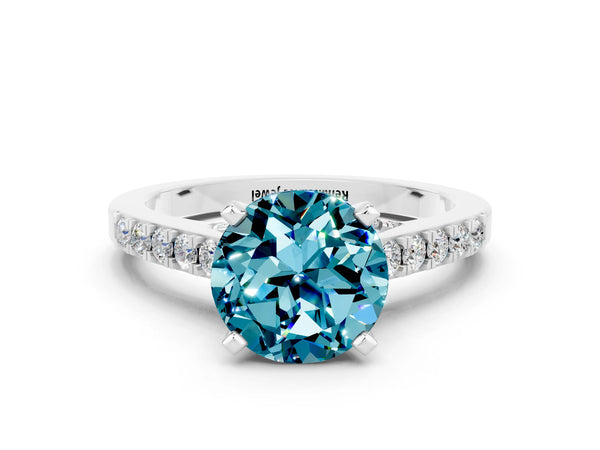 Platinum Round Cut Blue Topaz Solitaire Ring with Crossover Gallery and Round  Pavé Band
