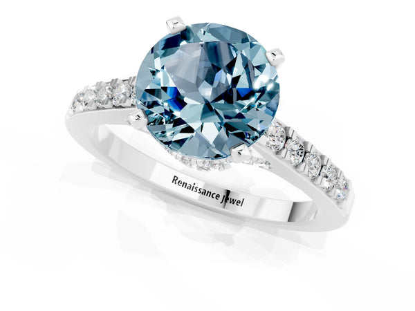 Platinum Round Cut Aquamarine Solitaire Ring with Crossover Gallery and Round  Pavé Band