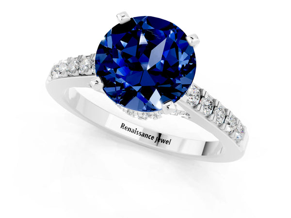 Platinum Round Cut Blue Sapphire Solitaire Ring with Crossover Gallery and Round  Pavé Band