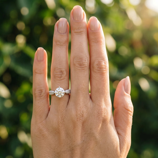 White gold Round Cut Diamond Solitaire Ring with Pavé-Set Shoulders and Four-Prong Setting