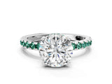 White gold Round Cut Diamond Solitaire Ring with Round with Green Sapphire side stone Pavé Band and Four-Prong Setting