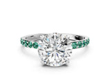 White gold Round Cut Diamond Solitaire Ring with Round with Green Sapphire side stone Pavé Band and Prong Setting