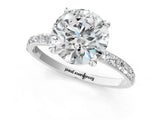 White gold Round Cut Diamond Solitaire Ring with Round with Moissanite side stone Pavé Band and Prong Setting_1