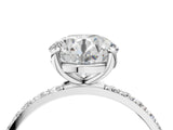 White gold Round Cut Diamond Solitaire Ring with Round with Moissanite side stone Pavé Band and Prong Setting_4