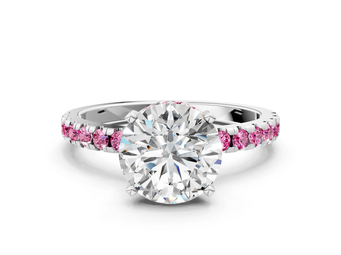 White gold Round Cut Diamond Solitaire Ring with Round with Pink Sapphire side stone Pavé Band and Four-Prong Setting
