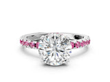 White gold Round Cut Diamond Solitaire Ring with Round with Pink Sapphire side stone Pavé Band and Four-Prong Setting