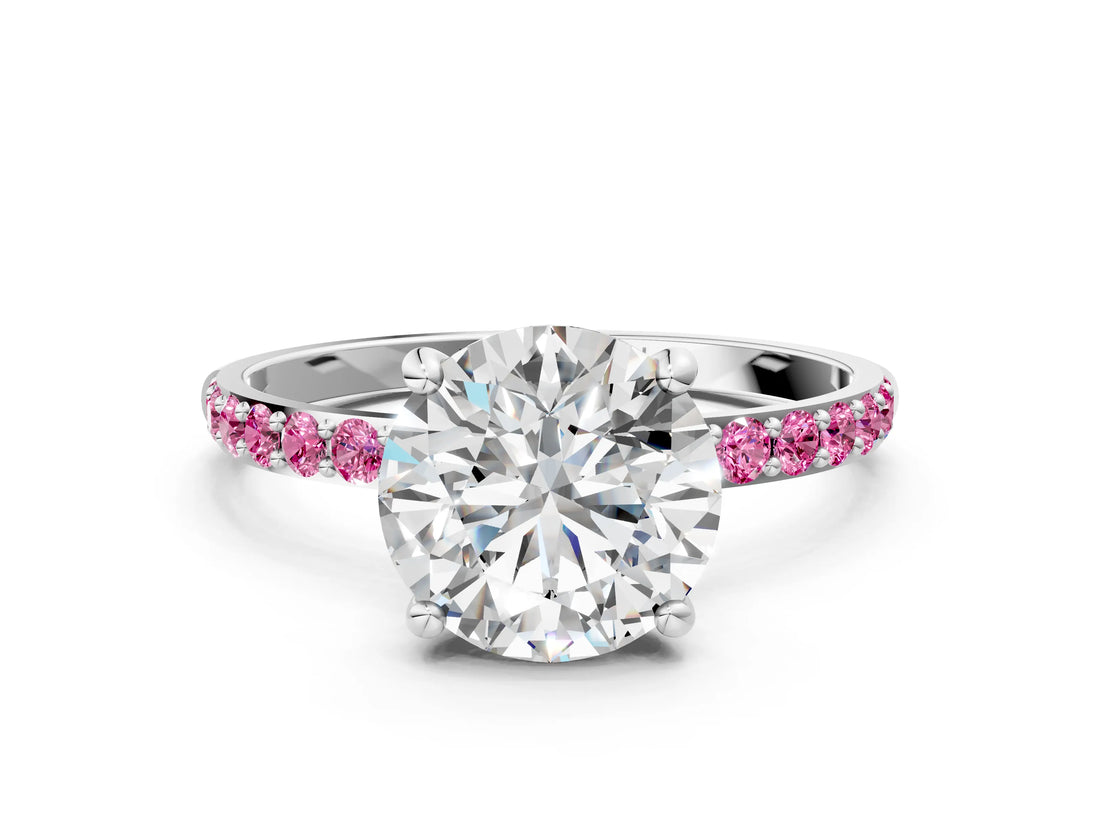 White gold Round Cut Diamond Solitaire Ring with Round with Pink Sapphire side stone Pavé Band and Prong Setting