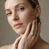 White gold Round Cut Diamond Solitaire Ring with Tapered Baguette Accents and Four-Prong Setting_104