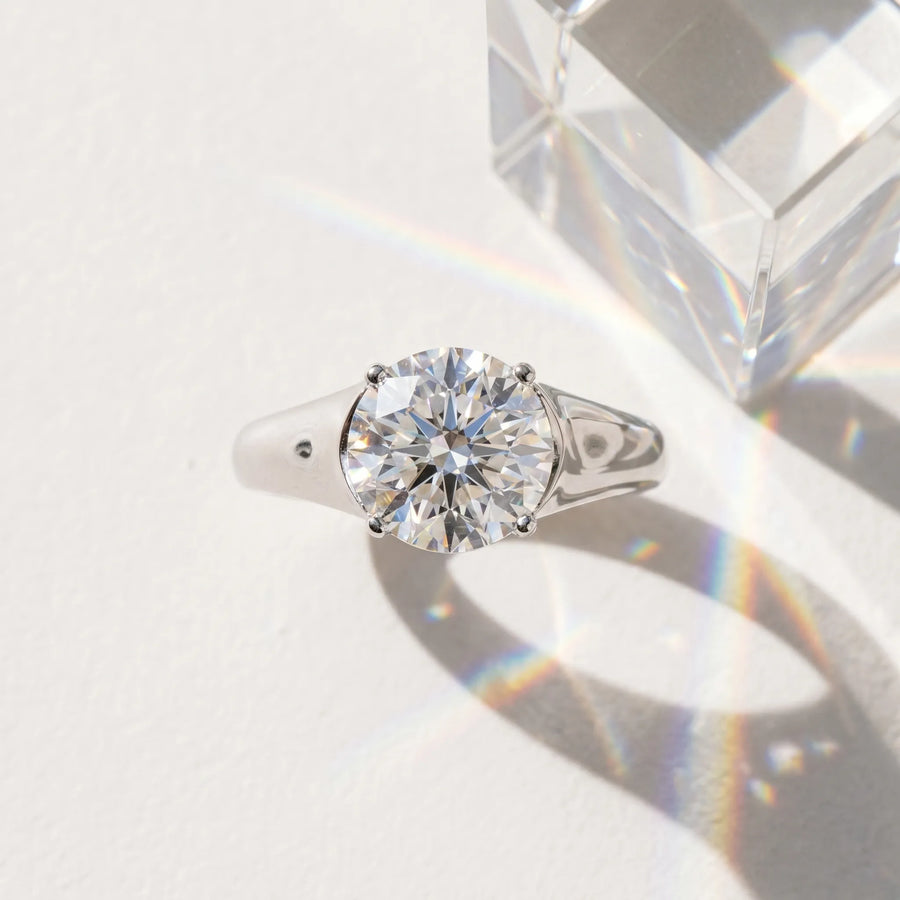 White gold Round Cut Diamond Solitaire Ring with Wide Band and Prong Setting