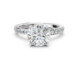 White gold Round Cut Diamond Solitaire with Pave Band and Four-Prong Setting