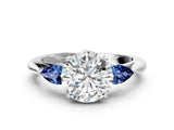 Silver 0.28 Carat D VVS2 Round Diamond Three-Stone Ring with Pear Side Stones and Prong Setting
