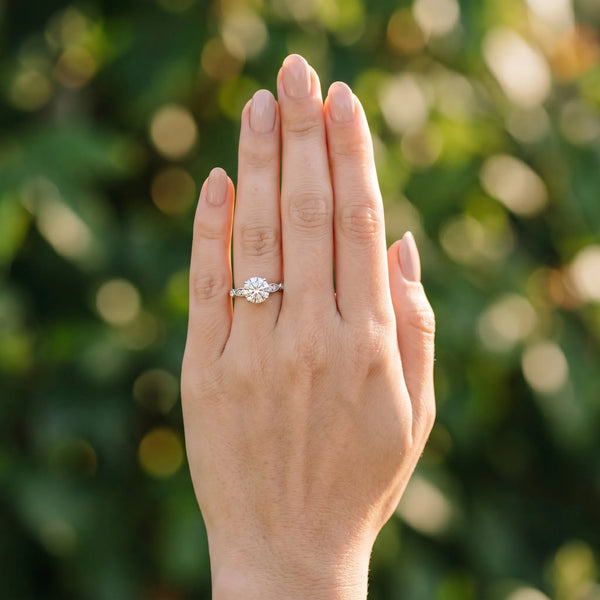 White gold Round Cut Diamond with Milgrain Marquise and Bezel Accents on a Solitaire Band with Prong Setting