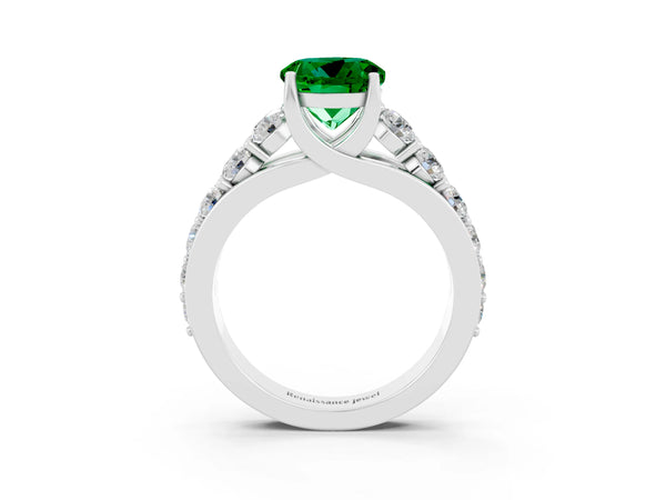 Silver Round Cut Emerald Engagement Ring with Pavé Band and Four-Prong Setting