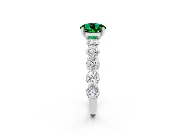 White gold Round Cut Emerald Prong Setting with Side Stones on a Pave Band