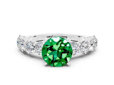 White gold Round Cut Emerald Prong Setting with Side Stones on a Pave Band