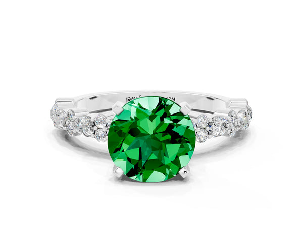 Platinum Round Cut Emerald Side Stone Solitaire Ring with Round  and Four-Prong Setting