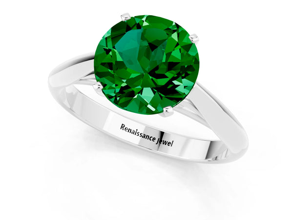 Silver Round Cut Emerald Solitaire Engagement Ring with Cathedral Setting and Four-Prong Mount