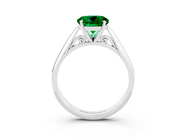 Platinum Round Cut Emerald Solitaire Engagement Ring with Cathedral Setting and Four-Prong Mount
