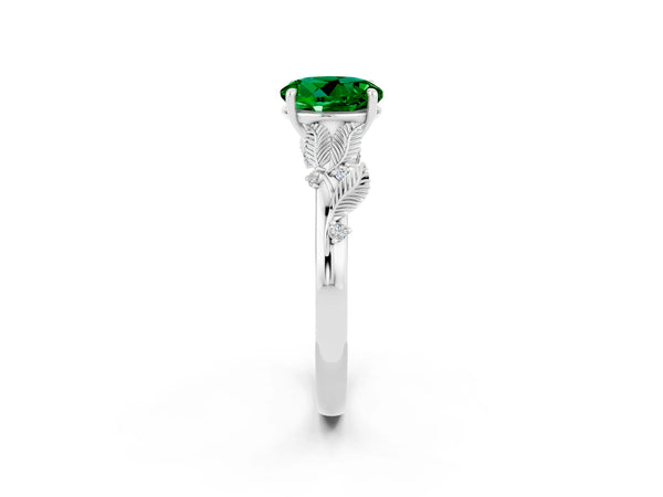 Silver Round Cut Emerald Solitaire Ring with Leaf Motif Band and Four-Prong Setting