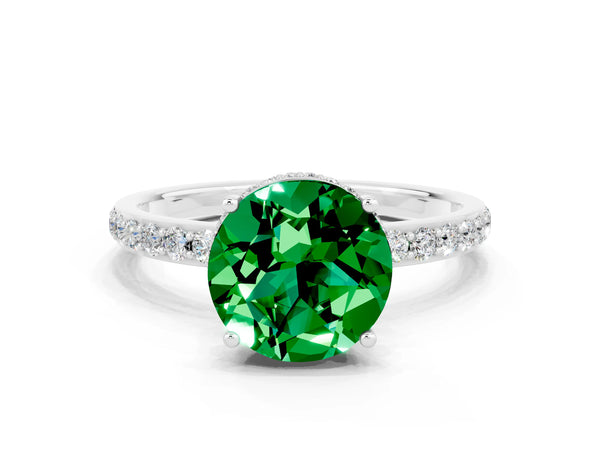 Silver Round Cut Emerald Solitaire Ring with Pavé Band and Hidden Halo