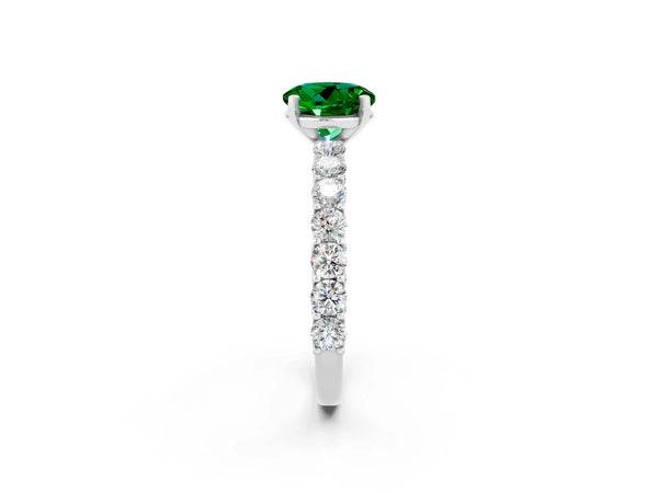 Platinum Round Cut Emerald Solitaire Ring with Shared Prong Pavé Band and Four-Prong Setting